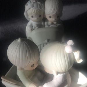 Precious Moments: couple in boat and couple in car